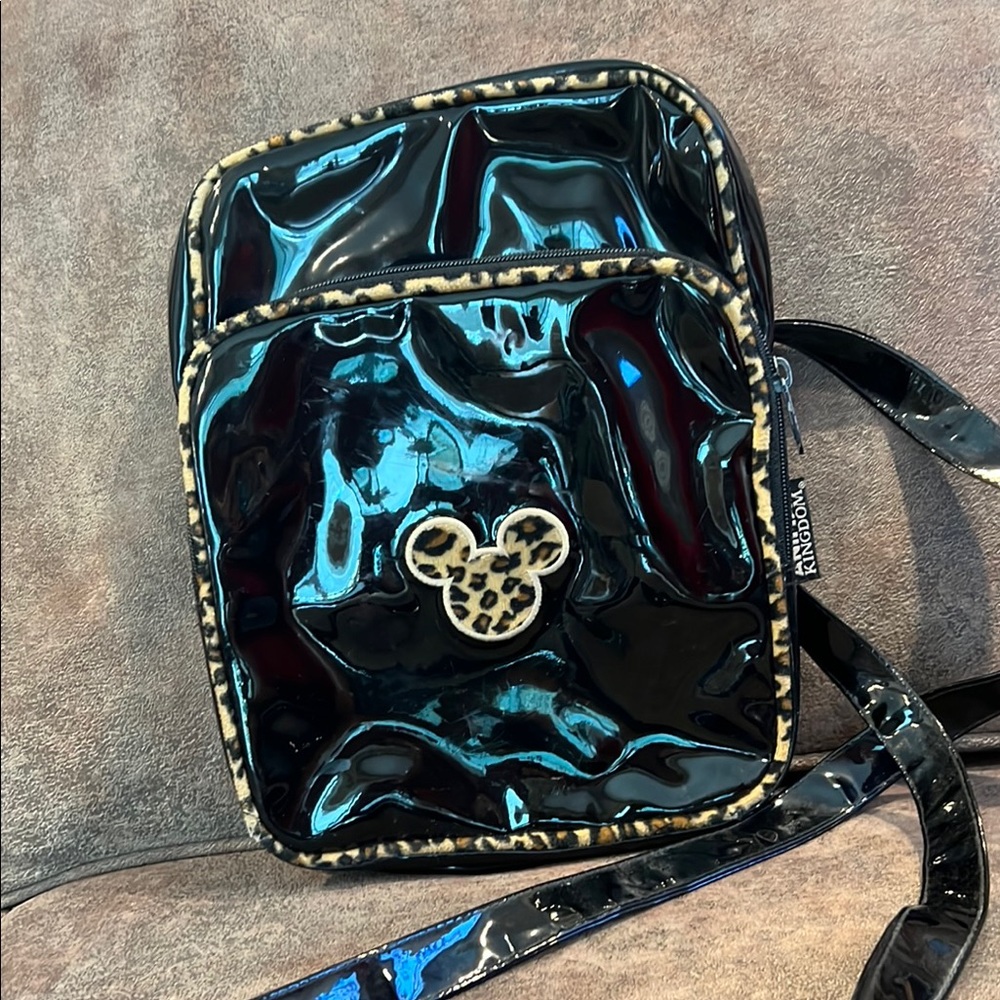 Disney Parks Black patent leather- looking bag with leopard Mickey Mouse Emblem